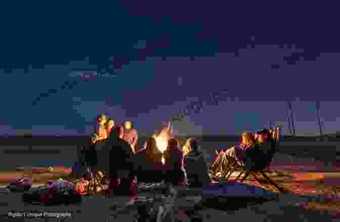 A Close Knit Family Gathered Around A Campfire, Surrounded By The Vast Chilcotin Landscape Chilcotin Yarns Bruce Watt