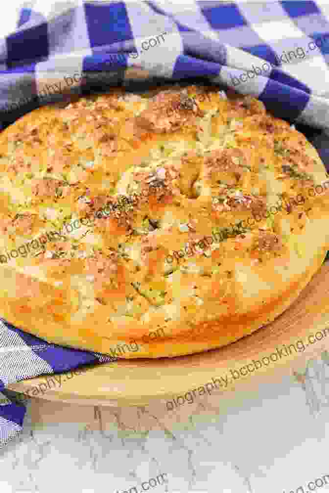 A Golden Brown Focaccia Bread Loaf Topped With Fresh Herbs And Sea Salt Sweet Loaf: 15 Sweet And Delicious Bread Recipes (Baking Dough Bread Machine)