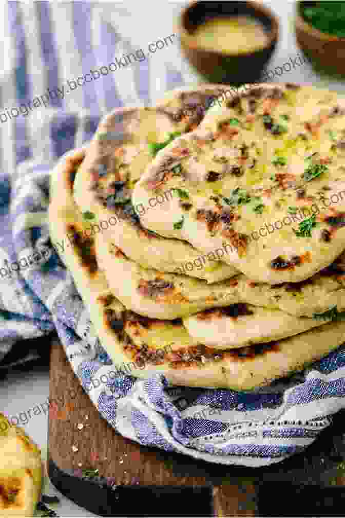 A Soft And Pliable Naan Bread Brushed With Garlic Butter Sweet Loaf: 15 Sweet And Delicious Bread Recipes (Baking Dough Bread Machine)
