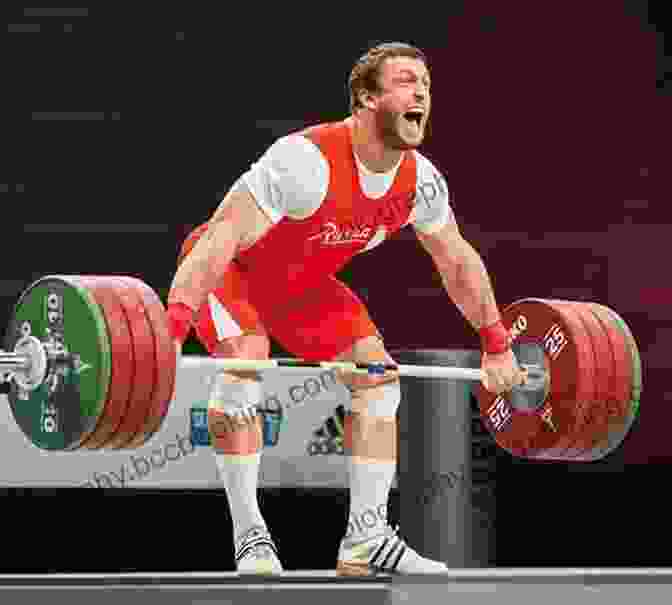 A Weightlifter Performing A Snatch, Lifting The Barbell Overhead In One Fluid Motion The Sport Of Olympic Style Weightlifting: Training For The Connoisseur