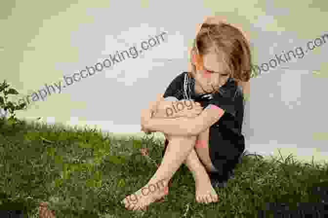 A Young Girl Sits Alone In A Field, Her Expression Tinged With Sadness And Longing. Boys In The Trees: A Memoir