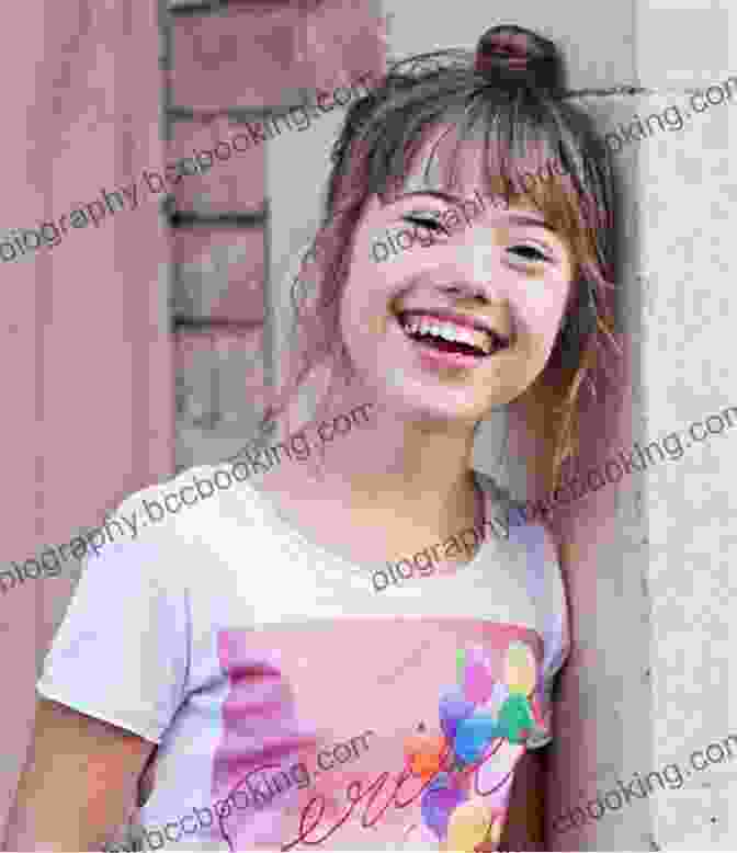 Caroline Finnerty, A Young Woman With Down Syndrome, Smiles And Holds A Book In Her Hands. My Sister S Child Caroline Finnerty