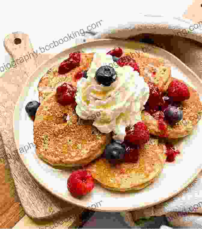 Fluffy Keto Pancakes Topped With Fresh Berries And Whipped Cream The Ultimate Guide To Keto Baking
