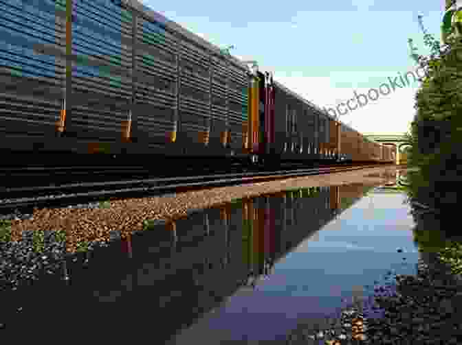 Freight Train Tracks Vanish Into The Horizon, Symbolizing The Journey's Endless Possibilities. The Sunset Route: Freight Trains Forgiveness And Freedom On The Rails In The American West